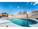 Sparkling kidney-shaped pool with patio seating at 8233 Ducharme Ave, Las Vegas, NV 89145