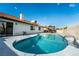 Inviting kidney-shaped pool with large patio at 8233 Ducharme Ave, Las Vegas, NV 89145