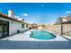 Refreshing kidney-shaped pool, ample patio space at 8233 Ducharme Ave, Las Vegas, NV 89145