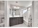 Double vanity bathroom with shower/tub combo at 8415 Quarentina Ave, Las Vegas, NV 89149