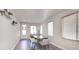 Bright dining area with wood floors and modern table at 8415 Quarentina Ave, Las Vegas, NV 89149