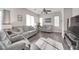 Living room with gray couches and wood-look floors at 8415 Quarentina Ave, Las Vegas, NV 89149