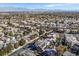 Aerial image showing neighborhood homes, distant mountain views, and a large park at 9225 Evergreen Canyon Dr, Las Vegas, NV 89134