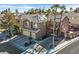 An aerial view of a house with a large yard, driveway and swimming pool at 9225 Evergreen Canyon Dr, Las Vegas, NV 89134