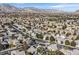 Aerial view of homes in a residential neighborhood, showcasing varied architecture and lush landscaping at 9225 Evergreen Canyon Dr, Las Vegas, NV 89134