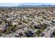 Aerial view of a residential neighborhood with houses, landscaping, and a mountain backdrop at 9225 Evergreen Canyon Dr, Las Vegas, NV 89134