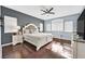 Elegant main bedroom with hardwood floors, large windows, and ensuite bathroom at 9225 Evergreen Canyon Dr, Las Vegas, NV 89134