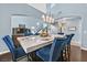 Elegant dining room with marble table and blue velvet chairs at 9225 Evergreen Canyon Dr, Las Vegas, NV 89134