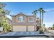 Two-story home with three-car garage and mature trees at 9225 Evergreen Canyon Dr, Las Vegas, NV 89134