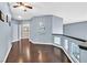 Upstairs hallway with dark hardwood floors and modern wall art at 9225 Evergreen Canyon Dr, Las Vegas, NV 89134