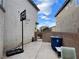 Small backyard with basketball hoop and patio at 9553 Madsen Glen Ct, Las Vegas, NV 89166