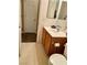 Simple bathroom with a vanity, toilet, and large mirror at 9553 Madsen Glen Ct, Las Vegas, NV 89166