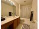 Clean bathroom with tub, shower, vanity, and mirror at 9553 Madsen Glen Ct, Las Vegas, NV 89166