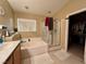 Bathroom with soaking tub, shower, and double vanity at 9553 Madsen Glen Ct, Las Vegas, NV 89166