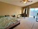 Spacious bedroom with queen bed, home gym, and balcony access at 9553 Madsen Glen Ct, Las Vegas, NV 89166