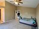 Bright bedroom with a queen-size bed and access to living room at 9553 Madsen Glen Ct, Las Vegas, NV 89166