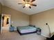 Large bedroom with a ceiling fan and a queen-size bed at 9553 Madsen Glen Ct, Las Vegas, NV 89166