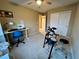 Bedroom with a desk, electronic drum set, and ample closet space at 9553 Madsen Glen Ct, Las Vegas, NV 89166