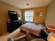 Well-lit bedroom with a large bed and a dresser at 9553 Madsen Glen Ct, Las Vegas, NV 89166