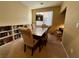 Bright dining room with built-in shelving and seating for six at 9553 Madsen Glen Ct, Las Vegas, NV 89166