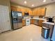 Bright kitchen with stainless steel fridge at 9553 Madsen Glen Ct, Las Vegas, NV 89166