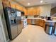 Well-equipped kitchen featuring stainless steel appliances and ample wood cabinetry at 9553 Madsen Glen Ct, Las Vegas, NV 89166