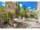 Landscaped backyard with patio and seating area, great for relaxing at 9757 Marcelline Ave, Las Vegas, NV 89148