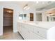 Double vanity bathroom with walk-in closet access at 9757 Marcelline Ave, Las Vegas, NV 89148