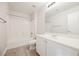 Bathroom with tub, toilet and vanity with mirror at 9757 Marcelline Ave, Las Vegas, NV 89148