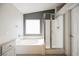 Bathroom with soaking tub, shower, and gray accent wall at 9757 Marcelline Ave, Las Vegas, NV 89148