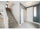 Bright entryway with stairs, coat closet, and wood-look floors at 9757 Marcelline Ave, Las Vegas, NV 89148