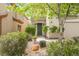 Green front door entrance with landscaping and walkway at 9757 Marcelline Ave, Las Vegas, NV 89148