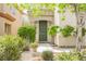 Green front door with landscaping and walkway at 9757 Marcelline Ave, Las Vegas, NV 89148