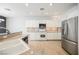 Modern kitchen with white cabinets and granite countertops at 9757 Marcelline Ave, Las Vegas, NV 89148