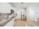 Spacious kitchen with white cabinets, granite counters, and stainless steel appliances at 9757 Marcelline Ave, Las Vegas, NV 89148