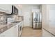 Modern kitchen with stainless steel appliances and white cabinets at 9757 Marcelline Ave, Las Vegas, NV 89148