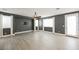 Large living room with ceiling fan and gray walls at 9757 Marcelline Ave, Las Vegas, NV 89148