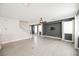 Bright and airy living room with wood-look floors and stairs at 9757 Marcelline Ave, Las Vegas, NV 89148