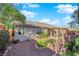 Landscaped backyard with covered patio at 10125 James Harbin Ave, Las Vegas, NV 89129