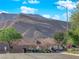 Desert community street view with mountain backdrop at 10125 James Harbin Ave, Las Vegas, NV 89129