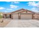 Charming single-story home features a two-car garage, neutral tones, desert landscaping and a covered front porch at 1016 Pearl Peak St, Las Vegas, NV 89110