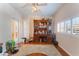 Bright home office features built-in shelving and hardwood floors at 10240 Clark Wooldridge Ct, Las Vegas, NV 89129