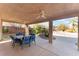 Covered patio with outdoor dining area and ceiling fan at 10240 Clark Wooldridge Ct, Las Vegas, NV 89129