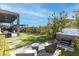 Relaxing backyard with a hot tub, comfortable seating area, and lush greenery for privacy and tranquility at 11015 Sanctuary Cove Ct, Las Vegas, NV 89135