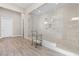 Modern bathroom showcasing a spacious walk-in shower with glass doors, tiled walls, and contemporary fixtures at 11015 Sanctuary Cove Ct, Las Vegas, NV 89135