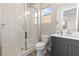 Modern bathroom with a glass-enclosed shower, vanity, and toilet at 11015 Sanctuary Cove Ct, Las Vegas, NV 89135
