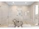 Luxurious bathroom featuring a large walk-in shower with dual shower heads, glass doors, and stylish tile work at 11015 Sanctuary Cove Ct, Las Vegas, NV 89135