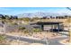 View of the Mesaridge community entrance with desert landscaping and mountains in the background at 11015 Sanctuary Cove Ct, Las Vegas, NV 89135