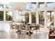Bright dining area with a farmhouse table, pendant lighting, and large windows at 11015 Sanctuary Cove Ct, Las Vegas, NV 89135
