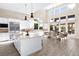 Open-concept kitchen featuring stainless steel appliances, large island, and an adjacent dining area at 11015 Sanctuary Cove Ct, Las Vegas, NV 89135